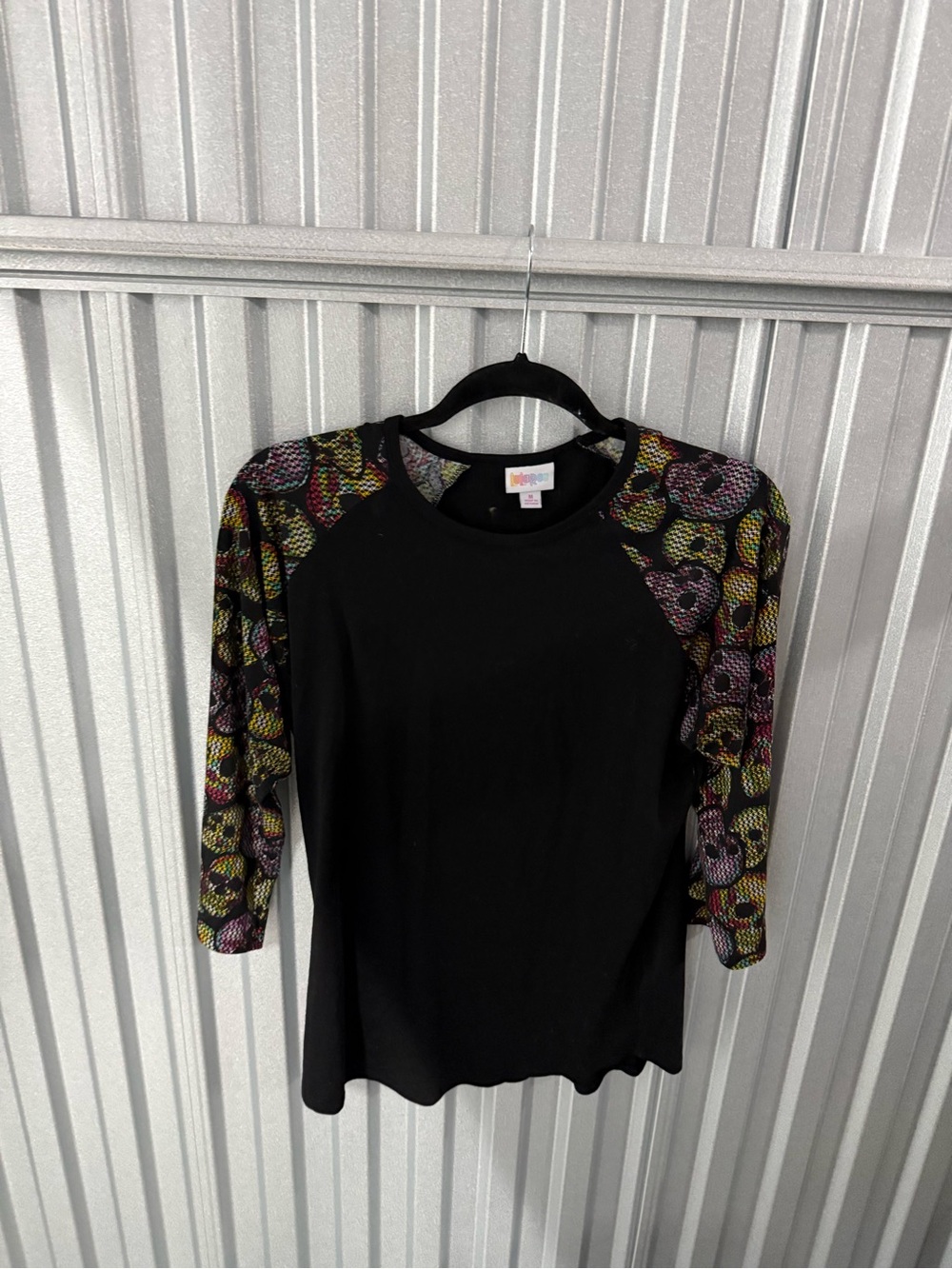 LuLaRoe Black Top with Multicolor Floral Raglan Sleeves